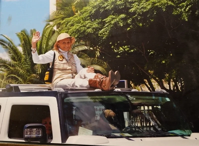 Helen Mortenson waving at a parade